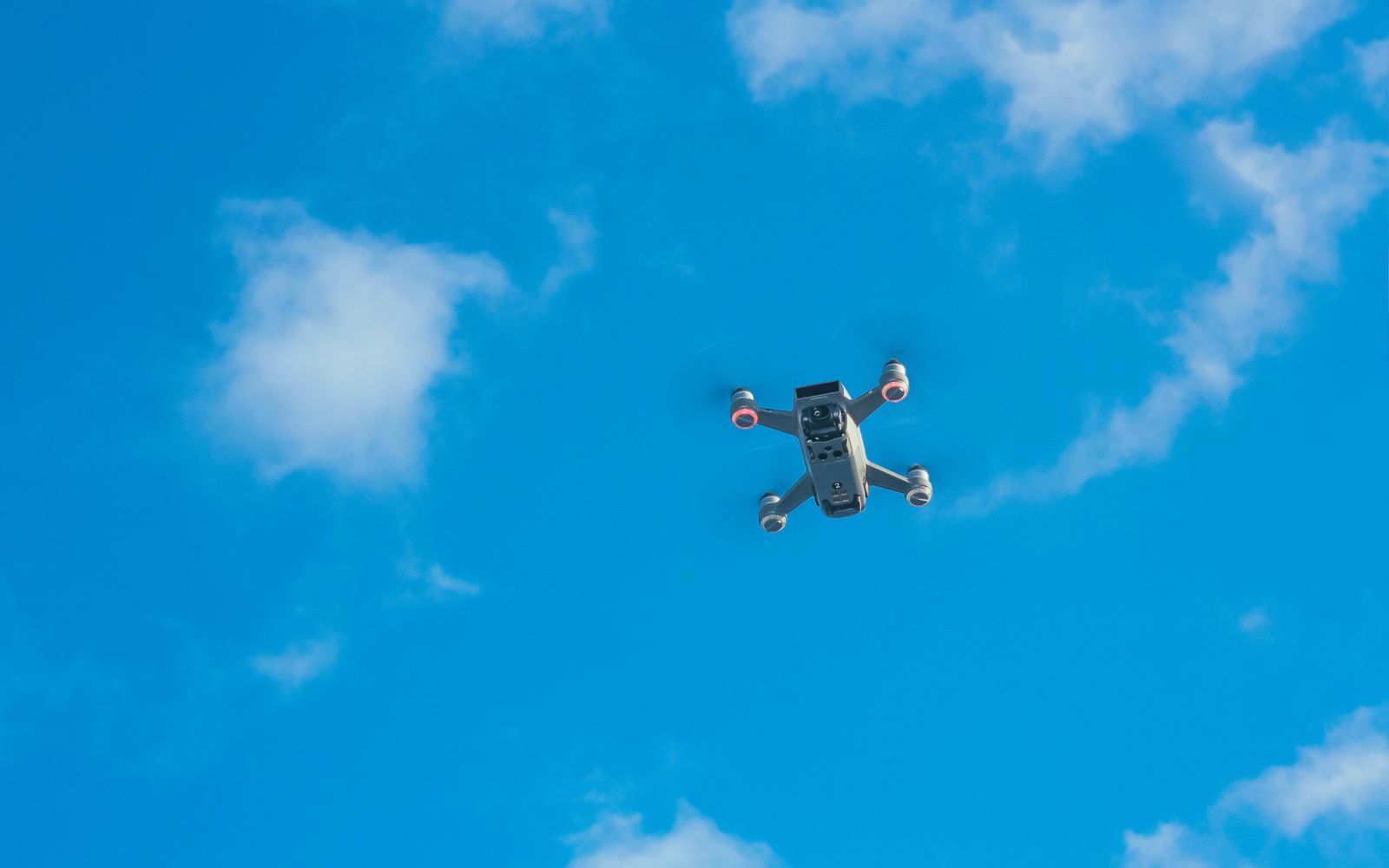 Camera drone in flight against a clear sky